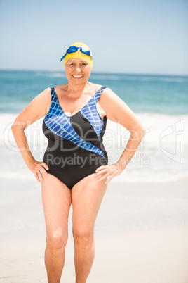 Senior woman with bathing cap at the beach
