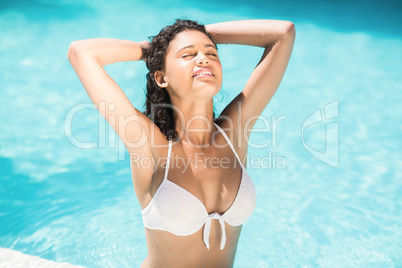 Beautiful woman relaxing in swimming pool