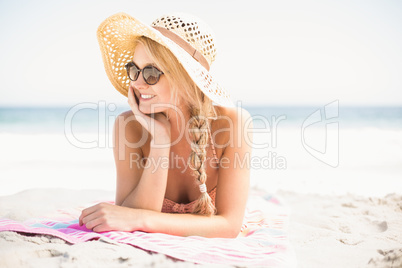 Happy woman lying on the beach