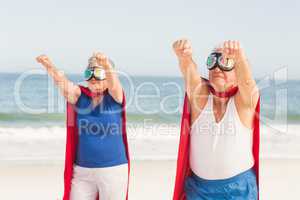 Senior couple wearing superman costume