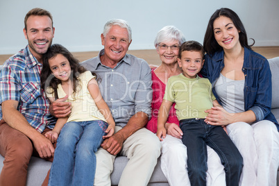 Family sitting on sofa