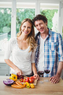 Portrait of smiling young couple in kitchen