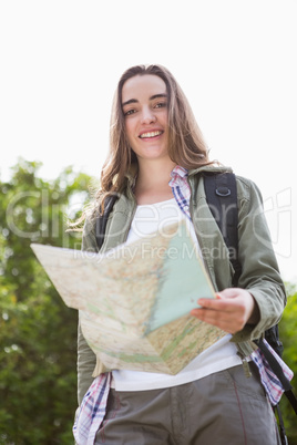 Smiling woman checking the map