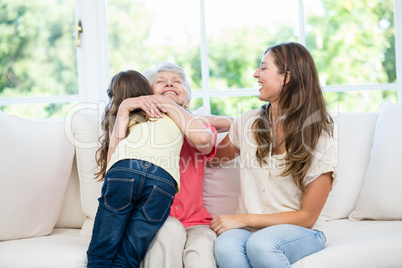 Senior woman hugging granddaughter