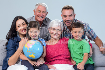 Happy family sitting on sofa