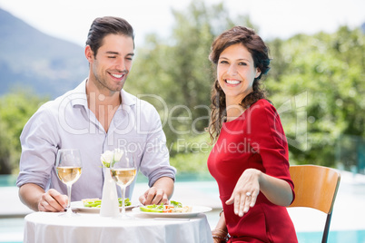 Portrait of smiling woman showing engagement ring