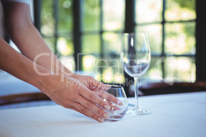 Waitress setting the table