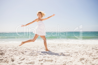 Pretty blonde woman jumping