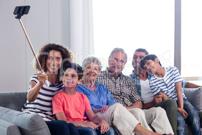 Happy family taking a selfie in living room