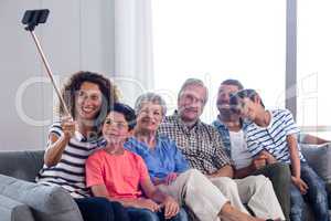 Happy family taking a selfie in living room