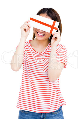 Happy young woman holding an envelope