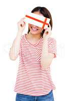 Happy young woman holding an envelope