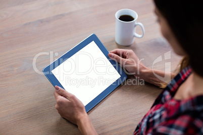 woman using digital tablet