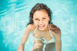 Portrait of beautiful woman in swimming pool