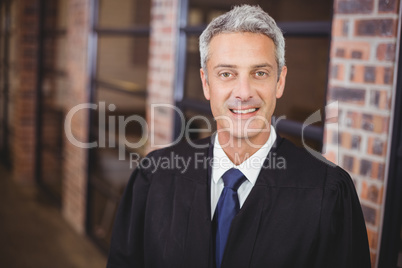 Portrait of happy male lawyer in office