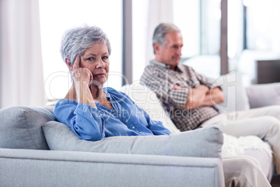 Upset senior couple ignoring each other