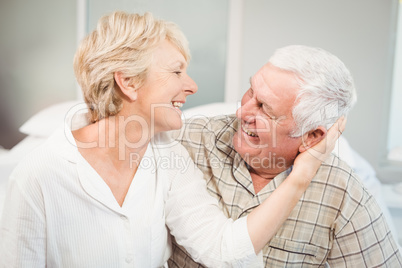 Happy senior woman romancing with husband