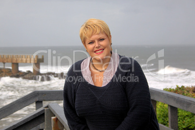 Lovely Mid Aged Woman at Cloudy Seaside