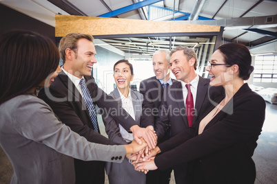 Businesspeople hands stacked over each other