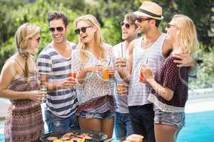 Group of happy friends having juice