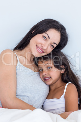 Woman relaxing with her daughter