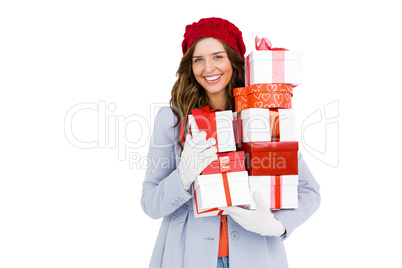 Young woman holding pile of gifts