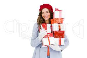 Young woman holding pile of gifts