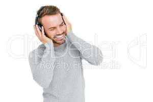 Young man listening music on headphones