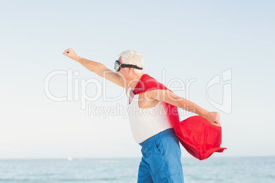 Senior man wearing superman costume