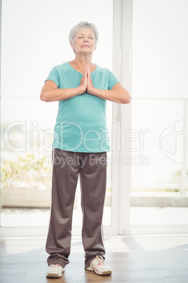 Senior woman performing yoga