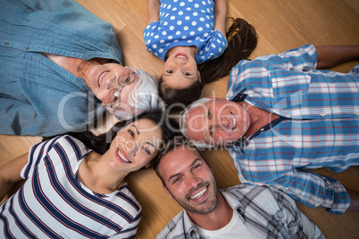 Happy family lying on floor
