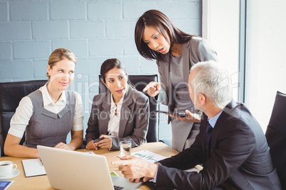Businesspeople interacting in conference room