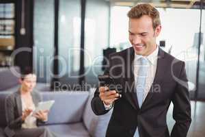 Businessman looking at mobile phone