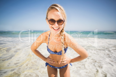 Portrait of happy woman standing on the beach