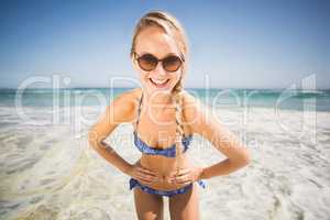 Portrait of happy woman standing on the beach