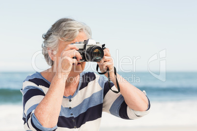 Senior woman taking picture