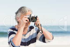 Senior woman taking picture