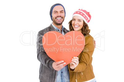 Happy young couple holding heart