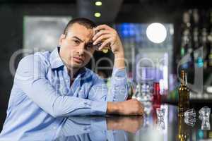 Depressed man drinking alcohol