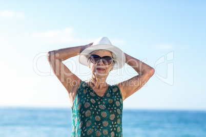 Senior woman posing with sunhat