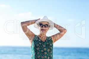 Senior woman posing with sunhat