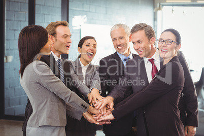 Businesspeople hands stacked over each other