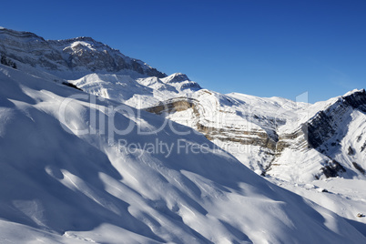 Off-piste slope at nice sun evening