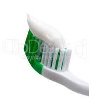 Green toothbrush with toothpaste