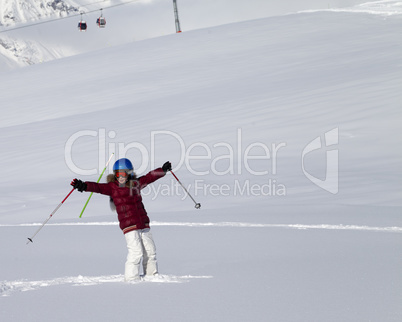 Happy girl on off-piste slope after snowfall at nice sun day