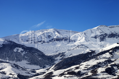 Snowy sunlight mountains at sun day