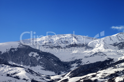 Snowy sunlight mountains at sun morning