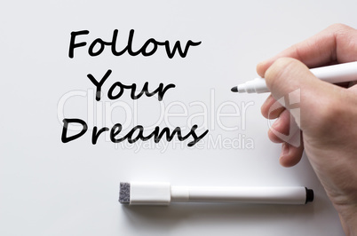 Follow your dreams written on whiteboard