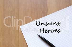 Unsung heroes write on notebook