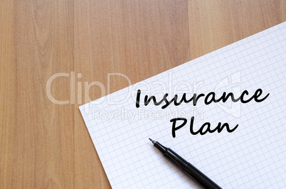 Insurance plan write on notebook